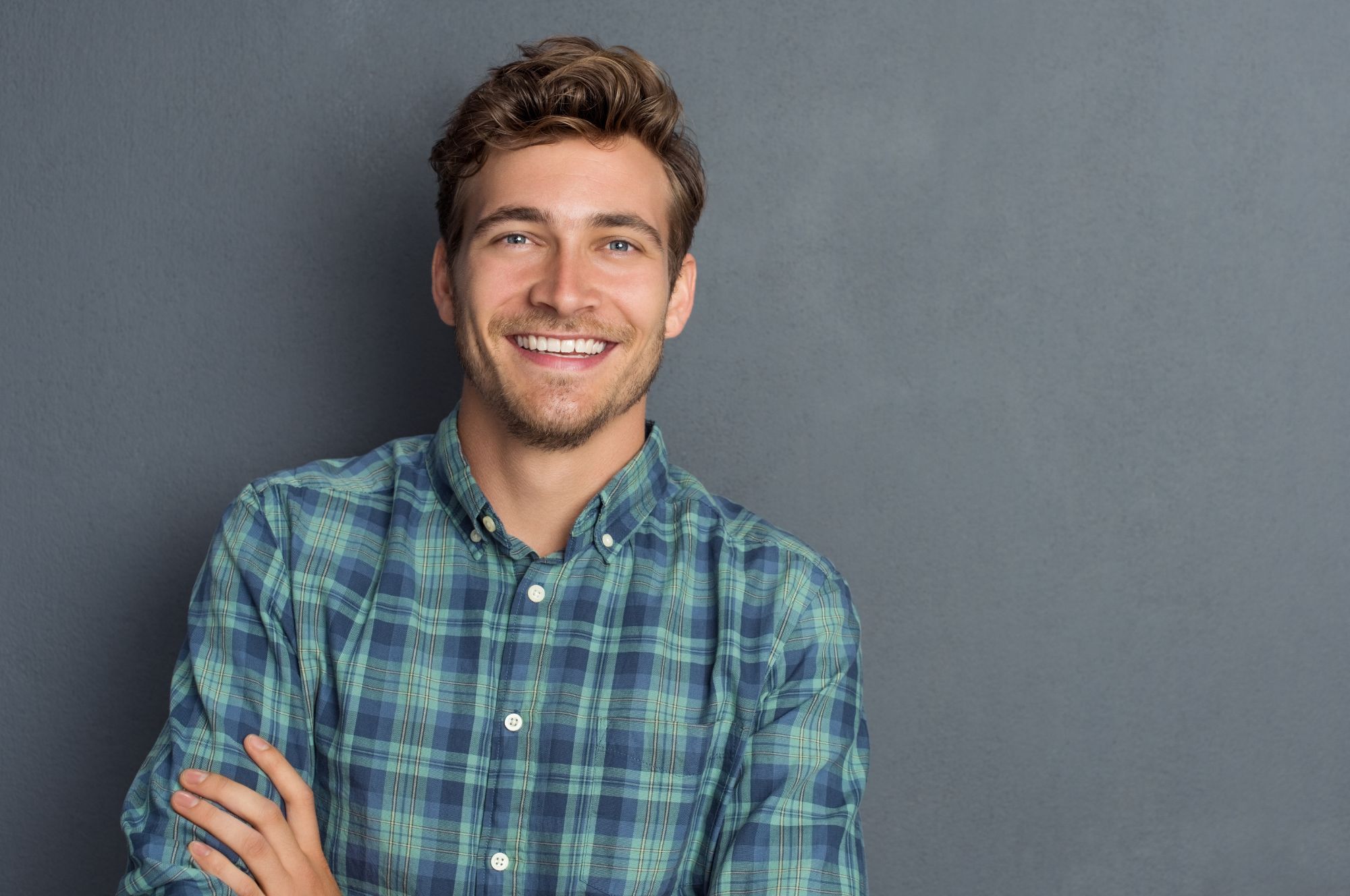 man smiling with straight teeth