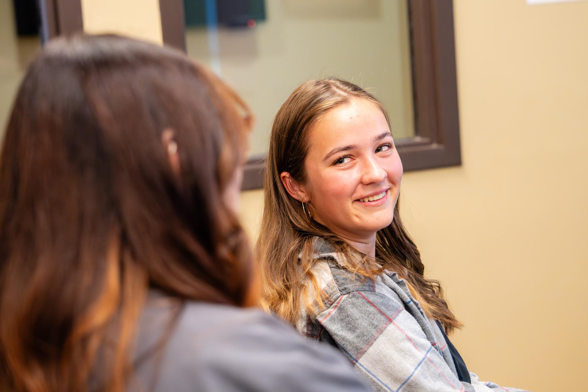 Smiling teen patient during her New Braunfels orthodontics appointment with Dr. Larry Layfield’s team at New Braunfels Orthodontic Associates